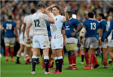  ?? GETTY IMAGES ?? England players Owen Farrell, left, and Ben Youngs digest the loss to France in Paris.