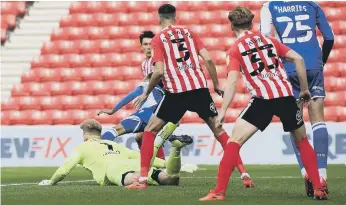  ??  ?? Lee Burge gives away a penalty early on in the game.