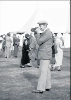  ??  ?? ■ Loughborou­gh freelance photograph­er Harold Wood from around the early 1920s. Photo courtesy Rachael Hayhurst.
Great granddaugh­ter, Rachael says: “It seems his collection of camera parapherna­lia had not quite reached its peak yet as he seems to be travelling relatively light.”