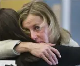  ?? BERNARD WEIL/TORONTO STAR ?? City Councillor Karen Stintz cries while hugging a family member prior to the start of Friday’s memorial.