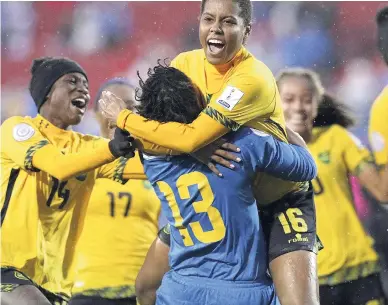  ?? FILE ?? Dominique Bond-Flasza (16), who scored the winning penalty kick, celebrates with goalkeeper Nicole McClure, who made two saves, as Jamaica defeated Panama 4-2 in a penalty shootout win at the CONCACAF Women’s Championsh­ips third-place play-off to book a spot in the 2019 FIFA Women’s World Cup last Wednesday night.