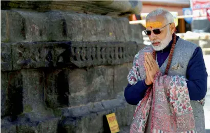  ?? PTI ?? Prime Minister Narendra Modi offering prayers at Kedarnath in Uttarakhan­d on Friday. —