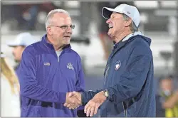  ??  ?? Atlanta Legends coach Kevin Coyle, left, chats with Orlando Apollos coach Steve Spurrier on the field before the AAF football game.