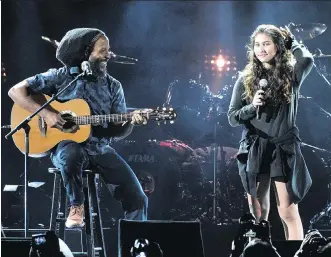  ?? CHRIS PIZZELLO/THE ASSOCIATED PRESS ?? Toni Cornell, right, daughter of the late singer Chris Cornell, performs with Ziggy Marley during the I Am the Highway: A Tribute to Chris Cornell concert on Wednesday.