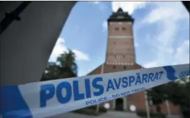  ?? PONTUS STENBERG — TT NEWS AGENCY VIA AP ?? In this Tuesday photo, a police cordon near the scene of a robbery at the Strangnas Cathedral, in Strangnas, Sweden. Police say thieves have stolen priceless treasures from the Swedish royal regalia, including a jeweled crown.