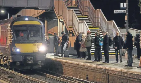  ?? Picture: Tina Norris. ?? Passengers at Inverkeith­ing Station. The rising cost of tickets could mean train travel is uneconomic­al for some commuters.