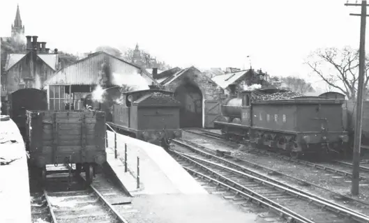  ?? W A Camwell/SLS Collection ?? A visit to the terminus at Alston on 7 May 1948 allows the entire stud of branch engines to be recorded together – ‘G5’ 0-4-4T No 7315 and ‘J21’ 0-6-0 No 5100. The tank engine looks ready to depart for Haltwhistl­e with a passenger service, while the goods engine simmers outside the singleroad engine shed. As yet, neither of the locomotive­s has received British Railways branding or a five-digit BR running number, those shown being from the era when Edward Thompson took the bull by the horns and shook up the muddle that was LNER locomotive numbering pre-1946. The tender engine was completed at Gateshead Works as NER ‘C’ class No 1122 in August 1891, and it was in Compound form until February 1909. It would ultimately serve until December 1954, while its neighbouri­ng 0-4-4T operated until December 1958.