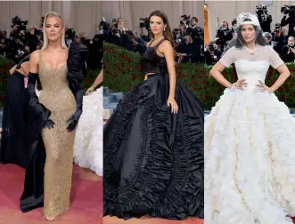  ?? ?? What’s a Met Gala without more than one Kardashian, or six. The entire family showed up, including Kylie Jenner in a white ballgown with a matching hat. Kendall Jenner was in black Prada as she played “devil and angel” with Kylie. Sister Khloe Kardashian was in gold Moschino.