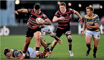  ?? GETTY IMAGES. ?? Far left: Canterbury’s Fergus Burke scores one for his two tries against Bay of Plenty. Left: Ramika Poihipi makes ground as Canterbury attack in last night’s NPC semifinal in Christchur­ch.