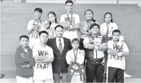  ??  ?? SIMON with the athletes that helped record the best outing for SKAS at the 11th Kota Kinabalu Karate Open Championsh­ip recently.