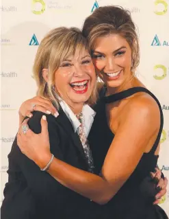  ??  ?? CLOSE FRIENDS: Olivia Newton John and Delta Goodrem.