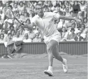  ?? — THE ASSOCIATED PRESS FILES ?? Gardnar Mulloy returns a shot against opponent Earl Buchholz at Wimbledon in 1959.