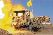  ?? SYRIAN CENTRAL MILITARY MEDIA VIA AP ?? A Hezbollah truck-mounted artillery piece blasts militant positions on the Lebanon-Syria border. The Syrian army and Lebanon’s Hezbollah launched the offensive Friday to remove militants.