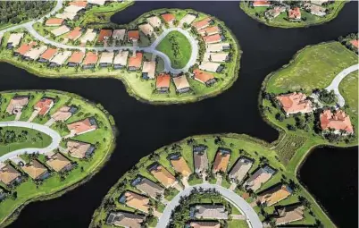  ?? Robert F. Bukaty / Associated Press ?? A housing developmen­t built in Everglades wetlands is seen from the air near Naples, Fla.