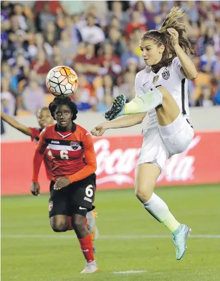  ?? — THE ASSOCIATED PRESS FILES ?? American forward Alex Morgan, right, has joined Lyon, a French league power, from the NWSL’s Orlando Pride on a six-month deal with an option for a further season.