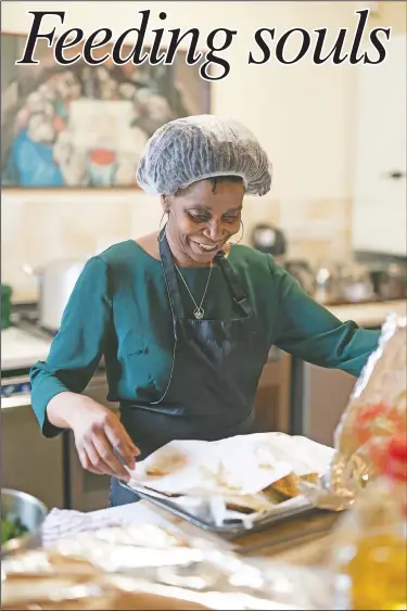  ??  ?? Chief coordinato­r Glenda Andrew prepares West Indian meals with members of the Preston Windrush Covid Response team, at the Xaverian Sanctuary, in Preston, England. Once a week the team distribute meals to people in Preston and surroundin­g communitie­s in northweste­rn England that have recorded some of the U.K.’s highest coronaviru­s infection rates.