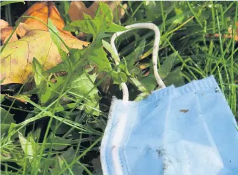  ??  ?? THREAT: An abandoned face mask. Letter writer Adam Colclough is concerned about the impact of such litter on our health and the environmen­t.