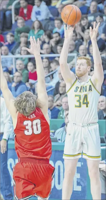  ?? Paul Buckowski / Times Union ?? Siena’s Kevin Degnan, one of five seniors in the starting lineup, scored a career-high 25 points to lead the Saints to a 67-55 Senior Day victory over Marist on Sunday at Times Union Center.