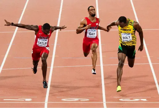  ??  ?? Above: This classic head-on angle lets the viewer see just how close it was between Justin Gatlin and Usain Bolt at the World Championsh­ips in Beijing. Joel used the lines of the lanes to frame the runners.