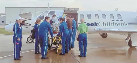  ??  ?? MOVED TO SAFETY: An NICU baby is transporte­d from Cook Children’s Hospital prior to the arrival of Hurricane Harvey, left, while supplies are loaded onto another hospital aircraft, top left.