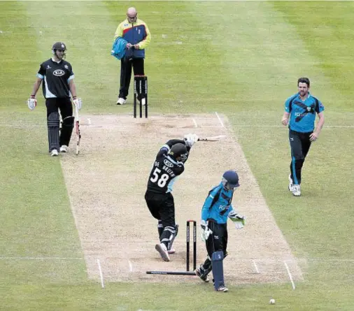  ??  ?? GRANITE DELIVERY: Aberdeen’s Gordon Goudie, right, celebrates after bowling out Surrey's Zander de Bruyn