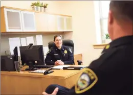  ?? Tyler Sizemore / Hearst Connecticu­t Media ?? Capt. Alison Hudyma chats with Capt. Jeremiah Marron at the Darien Police Department. Hudyma was recently promoted, making her the first woman to attain the rank of captain at the Darien Police Department.