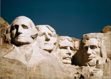  ?? AP FILE PHOTO ?? The statues of George Washington, Thomas Jefferson, Teddy Roosevelt and Abraham Lincoln are shown at Mount Rushmore in South Dakota. They consistent­ly rank among the best presidents.