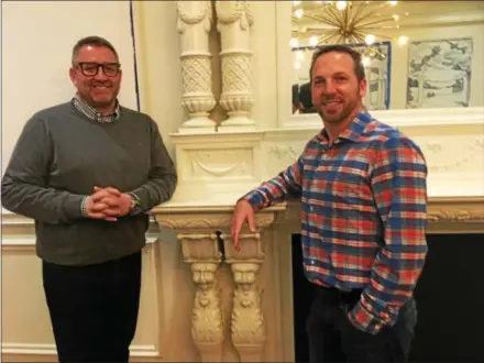  ?? GARY PULEO — DIGITAL FIRST MEDIA ?? Founding Farmers managing partner Fran Lake, left, and owner Dan Simons in the King of Prussia restaurant’s General’s Parlor room, featuring a refurbishe­d antique mantle. The room is hidden behind a faux library wall, and has become a popular spot for...