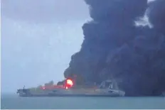  ?? GETTY IMAGES ?? This frame grab taken from Chinese state broadcaste­r CCTV shows smoke and flames coming from a burning oil tanker off the coast of eastern China. The crew of the Iranian tanker have not be found after the ship collided with a freighter carrying grain...