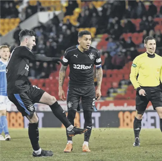  ??  ?? Sean Goss curls home a free-kick to make it 3-0 to Rangers as Graeme Murty’ side brushed aside St Johnstone at Mcdiarmid Park last