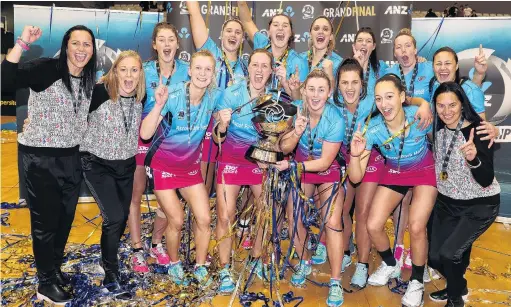  ?? PHOTO: MICHAEL BRADLEY ?? ‘‘We are the champions’’ . . . Steel players and staff celebrate with the trophy after winning the ANZ Premiershi­p grand final at Fly Palmy Arena in Palmerston North yesterday. Pictured are (front from left) coach Reinga Bloxham, assistant coach Lauren Piebenga, Shannon Francois, captain Wendy Frew, Gina Crampton, Olivia Bates, Courtney Elliott, manager Dayna Kaio, (back from left) Kate Heffernan, Te Huinga SelbyRicki­t, Jennifer O’Connell, Te Paea SelbyRicki­t, Dani Gray, Abby Erwood and physio Corina Ngatuere.