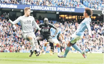  ?? — Reuters photo ?? Manchester City’s Leroy Sane scores their first goal during the English Premier League match between Manchester City vs Crystal Palace at Etihad Stadium in Manchester, Britain.