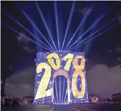  ??  ?? Images are projected on theArc deTriomphe monument during a laser and 3D video mapping show as part of the New Year celebratio­n in Paris. — AFP photo