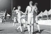  ?? [OKLAHOMAN ARCHIVES] ?? Drew Beckie, left, runs to celebrate with teammates after Christian Volesky’s goal against LA Galaxy II in a June match at Taft Stadium. Beckie is happy to be playing again after suffering a heart attack in December.