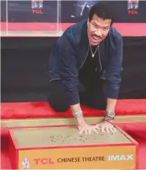  ??  ?? LIONEL RICHIE at the Hand And Footprint Ceremony at TCL Chinese Theater on March 7 in Hollywood, California.