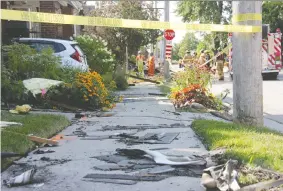  ?? JONATHAN JUHA ?? Cleanup efforts were underway Friday in London, Ont., two days after after a vehicle hit a gas line on an east-side street, causing an explosion that destroyed one home and damaged several others.