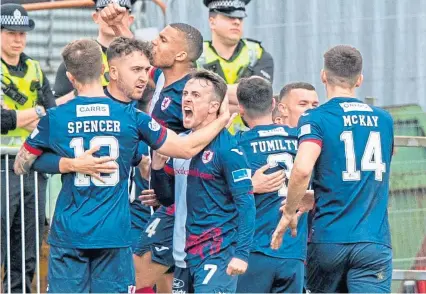  ?? ?? Raith Rovers players celebrate the late winner from Poplatnik