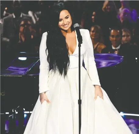  ?? KEVIN WINTER/GETTY IMAGES ?? Demi Lovato’s performanc­e at this year’s Grammys was her first since her overdose in 2018. The singer has been candid about her struggle with bipolar disorder, substance abuse and eating disorders, and says she tries to continue to educate herself.