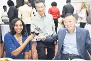  ??  ?? Shorna-Kay Richards, director of the Bilateral Relationsh­ips Department in the Ministry of Foreign Affairs and Foreign Trade; Fan Jianghong, economic and commercial counsellor at the Chinese Embassy; and Tian Qi, Chinese ambassador to Jamaica, toast the evening’s exciting affair.