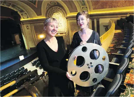  ?? DAN JANISSE ?? Oona Mosna, right, program director of the Media City Film Festival and festival assistant Sarah Kelly make preparatio­ns at the Capitol Theatre on Tuesday. The festival opens its 22nd year on Wednesday.