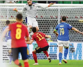  ?? GETTY IMAGES ?? Gigio Donnarumma anticipa Ferran Torres in un’insolita uscita di testa