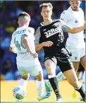  ??  ?? THREAT: Derby’s Krystian Bielik shoots past Leeds’ Jamie Shackleton