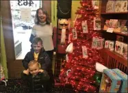  ?? LAUREN HALLIGAN — MEDIANEWS GROUP ?? G. Willikers Toys owner Linda Ambrosino is joined by some young shoppers on Sunday at her toy store in Saratoga Springs.