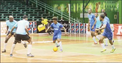  ?? ?? Melanie’s Phillip Williams (centre) attempting to start a counteratt­ack against the Berbice All-Stars at the Cliff Anderson Sports Hall on Homestretc­h Avenue in the Guyana Football Federation (GFF)/Kashif and Shanghai Organizati­on Futsal Championsh­ip