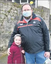  ??  ?? SET FOR SOME FUN - Dave Griffin with his daughter, Hannah, waiting outside the gates of Bunscoil na Toirbhirte, Mitchelsto­wn as Hannah happily returned to school once again this week.