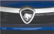  ??  ?? A PROTON LOGO on a car at a Proton showroom in Puchong, Malaysia Oct. 3, 2016.