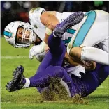  ?? PATRICK SMITH / GETTY IMAGES ?? Baltimore quarterbac­k Joe Flacco is in the league’s concussion protocol after being knocked out of the game by linebacker Kiko Alonso late in the first half Thursday night.