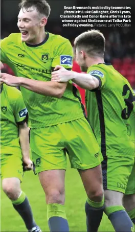  ?? Pictures: Larry McQuillan ?? Sean Brennan is mobbed by teammates (from left) Luke Gallagher, Chris Lyons, Ciaran Kelly and Conor Kane after his late winner against Shelbourne at Tolka Park on Friday evening.