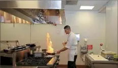  ?? Pam Panchak/Post-Gazette ?? A view from the chef’s table at Bruneaux restaurant in Sewickley shows Matthew Reagan making lunch.