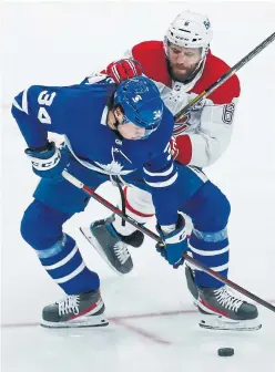  ?? RICK MADONIK TORONTO STAR ?? The Leafs’ Auston Matthews fends off Canadiens hard-rock defenceman Shea Weber and controls the puck in the second period of Saturday night’s game.